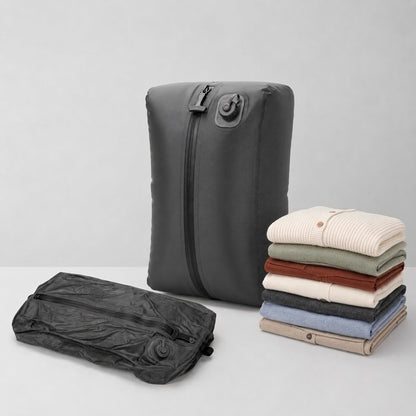 WayHome compression bag beside the same bag flattened, next to a stack of folded clothes